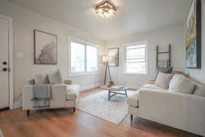 Living room featuring wood finished floors and baseboards