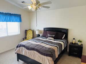 Bedroom with carpet and ceiling fan