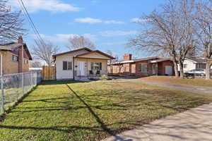 View of front of home featuring driveway and covered porch