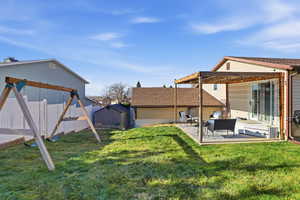 View of yard with a patio, a playground, and an outdoor living space