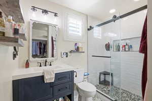 Primary Bathroom featuring vanity and a shower stall