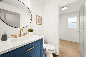 Bathroom with vanity and light wood finished floors