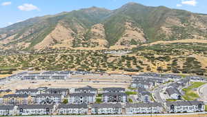 View of mountain backdrop featuring nearby suburban area