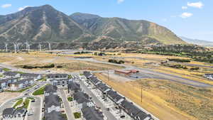 View of mountain backdrop featuring nearby suburban area