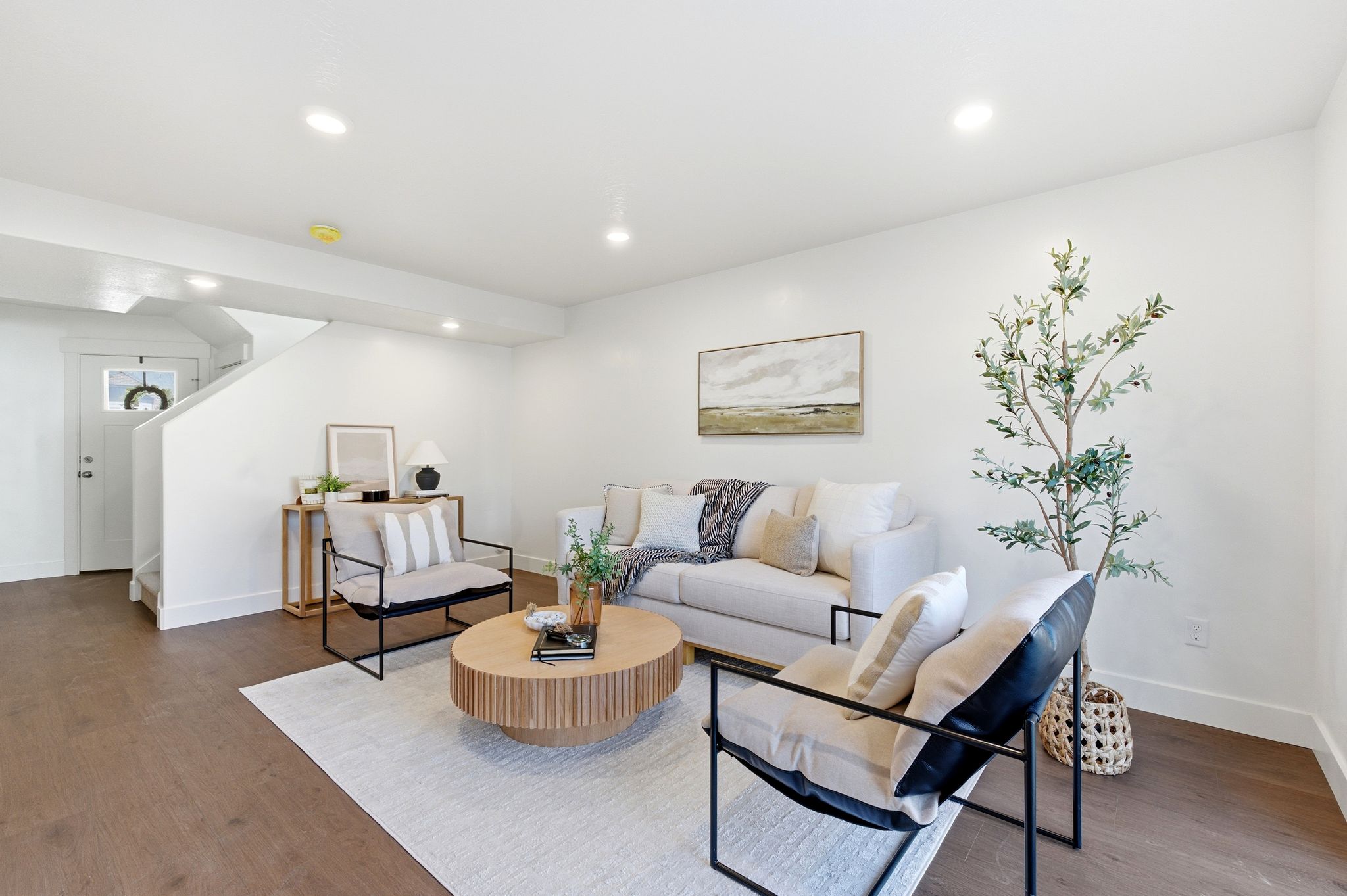 Living room featuring wood finished floors and recessed lighting
