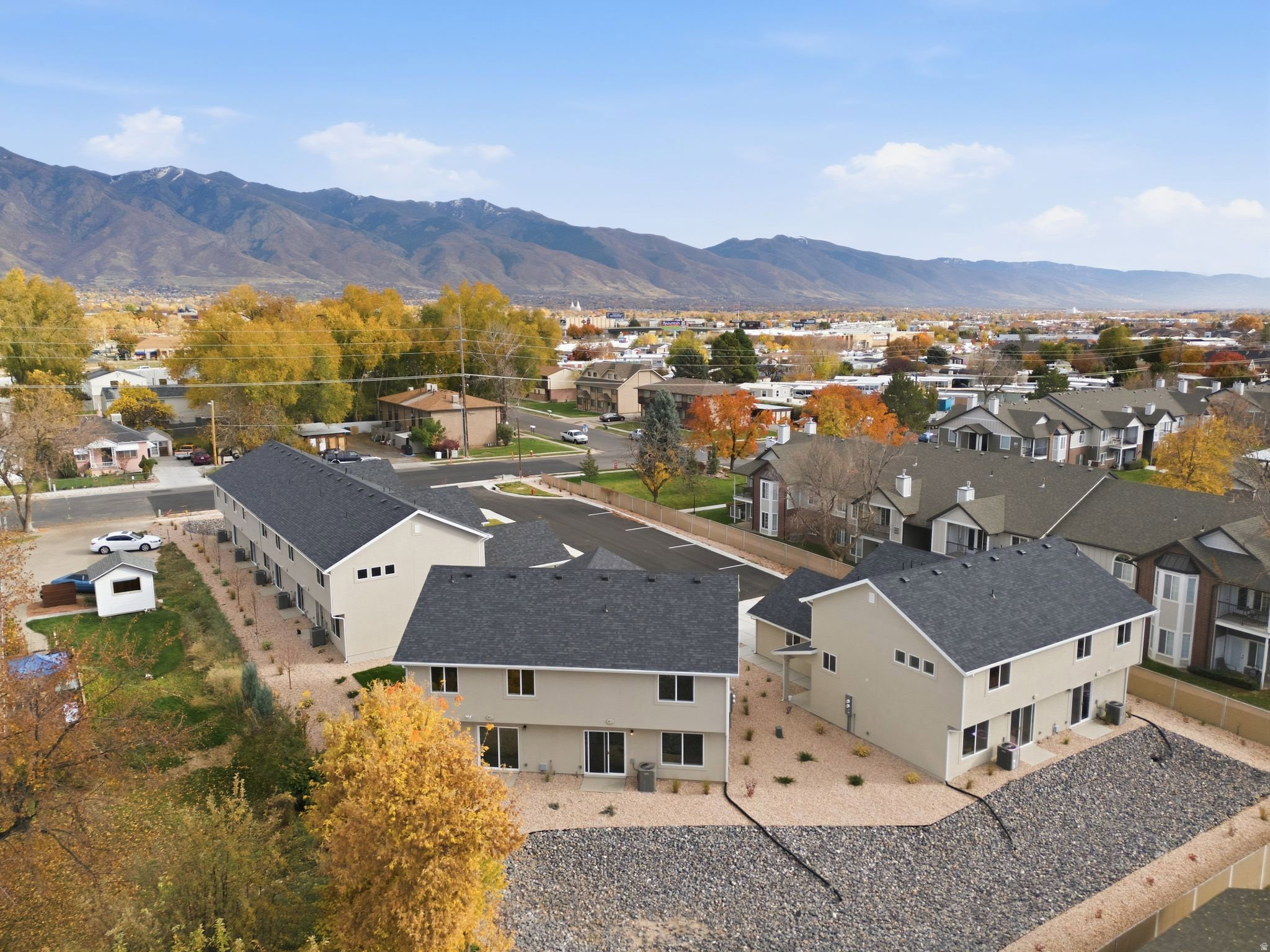 Aerial perspective of suburban area with a mountain backdrop