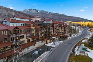 Snowy aerial view featuring a mountain view