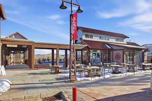 View of community featuring a patio area and a mountain view