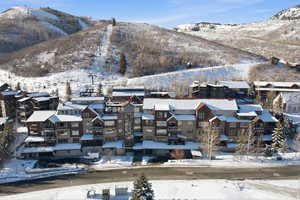 Snowy aerial view with a mountain view