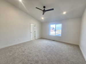 Spare room with lofted ceiling, light colored carpet, recessed lighting, and a ceiling fan