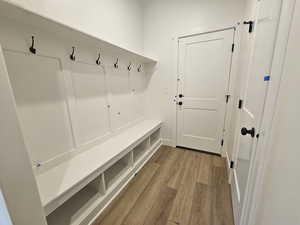 Mudroom with light wood-style floors