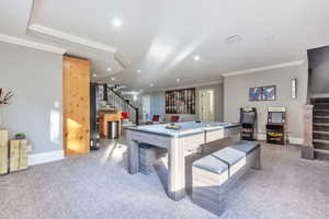 Game room with ornamental molding, light carpet, and recessed lighting
