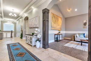 Common area with lofted ceiling and recessed lighting