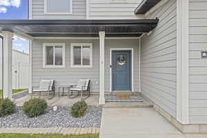 Entrance to property with a porch