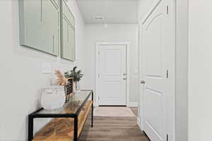 Hall with dark wood finished floors