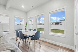 Dining space featuring light wood-style flooring, healthy amount of natural light, and recessed lighting