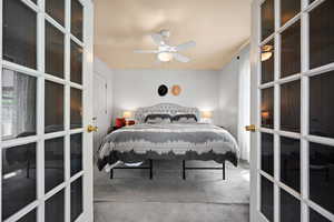 Bedroom with carpet flooring and a ceiling fan