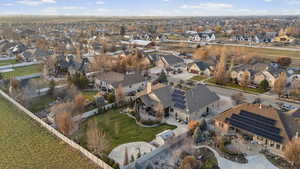 Aerial view of property's location featuring nearby suburban area