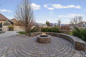 View of patio featuring a fire pit