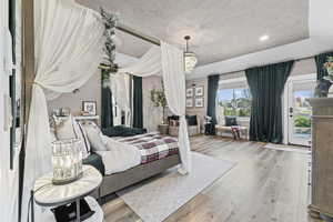 Bedroom with hardwood / wood-style flooring