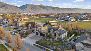 View of property location featuring nearby suburban area and a mountain backdrop