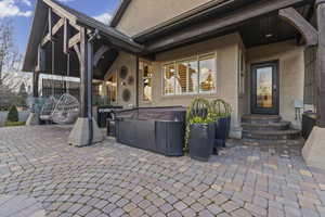 View of patio / terrace with a hot tub