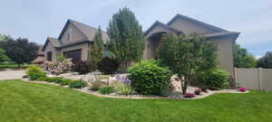 View of front of home with stone siding and stucco siding