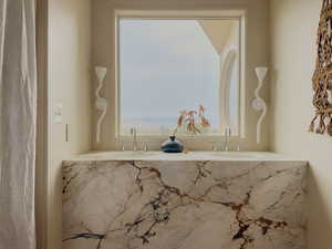 Bathroom with healthy amount of natural light and double vanity