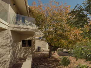 View of home's exterior featuring brick siding and a central air condition unit