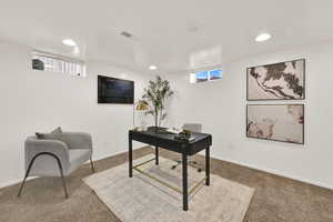 Office space featuring carpet flooring and recessed lighting