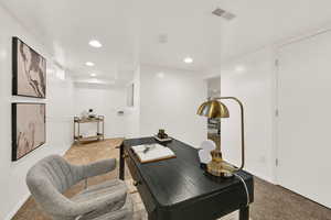 Office space featuring carpet flooring and recessed lighting