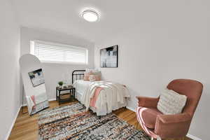 Bedroom with wood floors