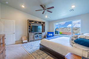 Bedroom featuring vaulted ceiling, ceiling fan, carpet flooring, and recessed lighting