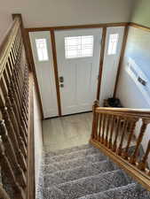 Entrance foyer with plenty of natural light and light wood-type flooring