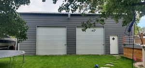 View of outdoor structure with a trampoline
