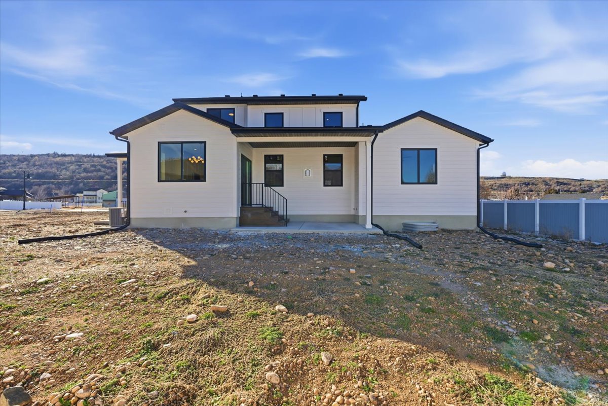 Back of property with a patio area