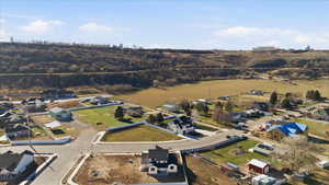 Aerial overview of property's location featuring nearby suburban area