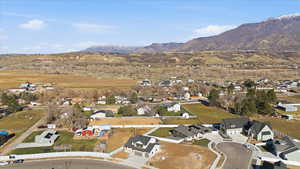 View of property location featuring a mountainous background and nearby suburban area