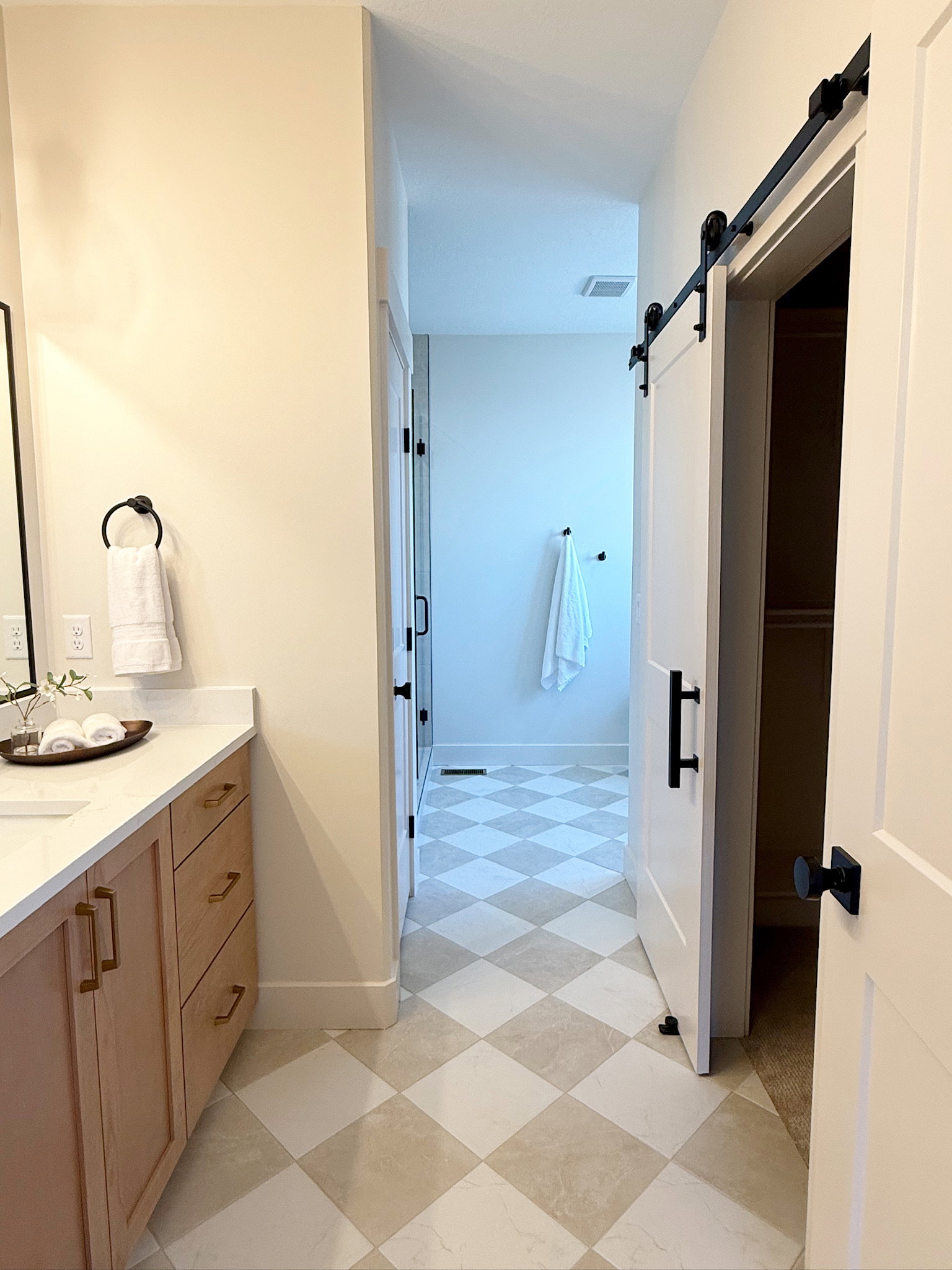 Bathroom with vanity and light flooring