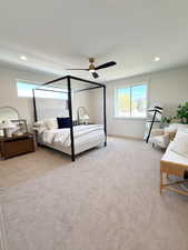 Bedroom featuring ceiling fan, recessed lighting, multiple windows, and light colored carpet