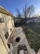 Fenced backyard with a patio