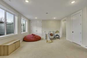 Recreation room featuring carpet floors and recessed lighting