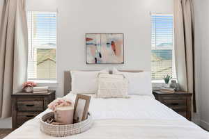 Primary bedroom with multiple windows