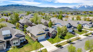 Aerial perspective of suburban area with a mountain backdrop