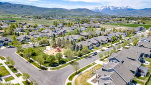 Aerial view of residential area featuring a mountain backdrop
