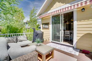 Deck featuring an outdoor hangout area and grilling area