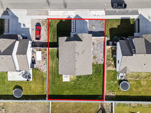 Aerial perspective of suburban area featuring property boundaries highlighted