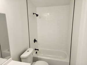 Full bathroom featuring vanity and shower / washtub combination