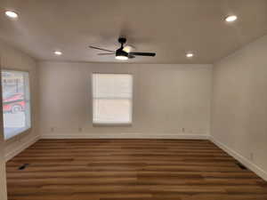 Empty room with recessed lighting, dark wood finished floors, and a ceiling fan
