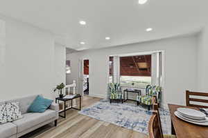 Living room featuring light wood-style floors and recessed lighting